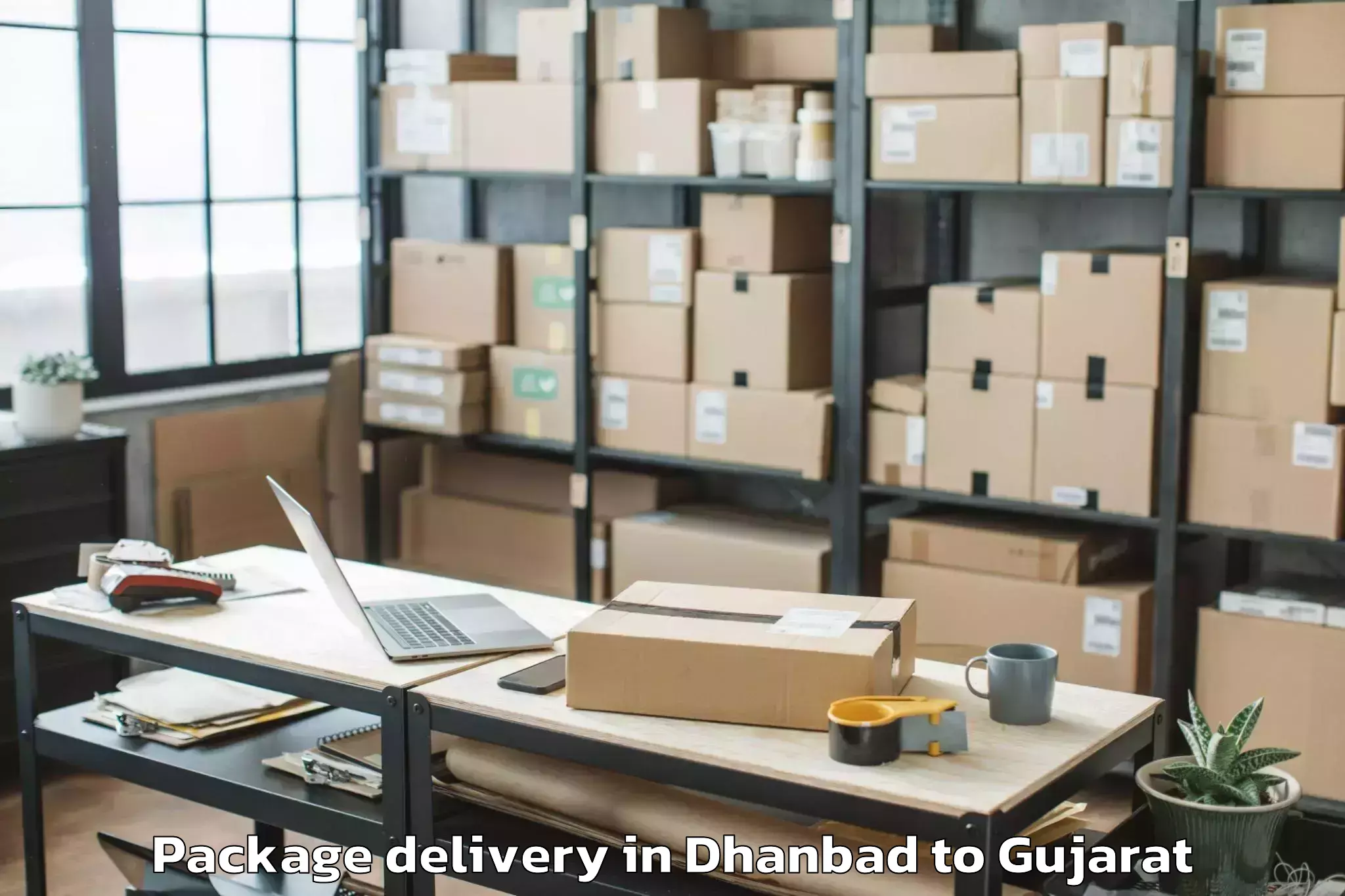 Book Your Dhanbad to Gujarat National Law Universit Package Delivery Today